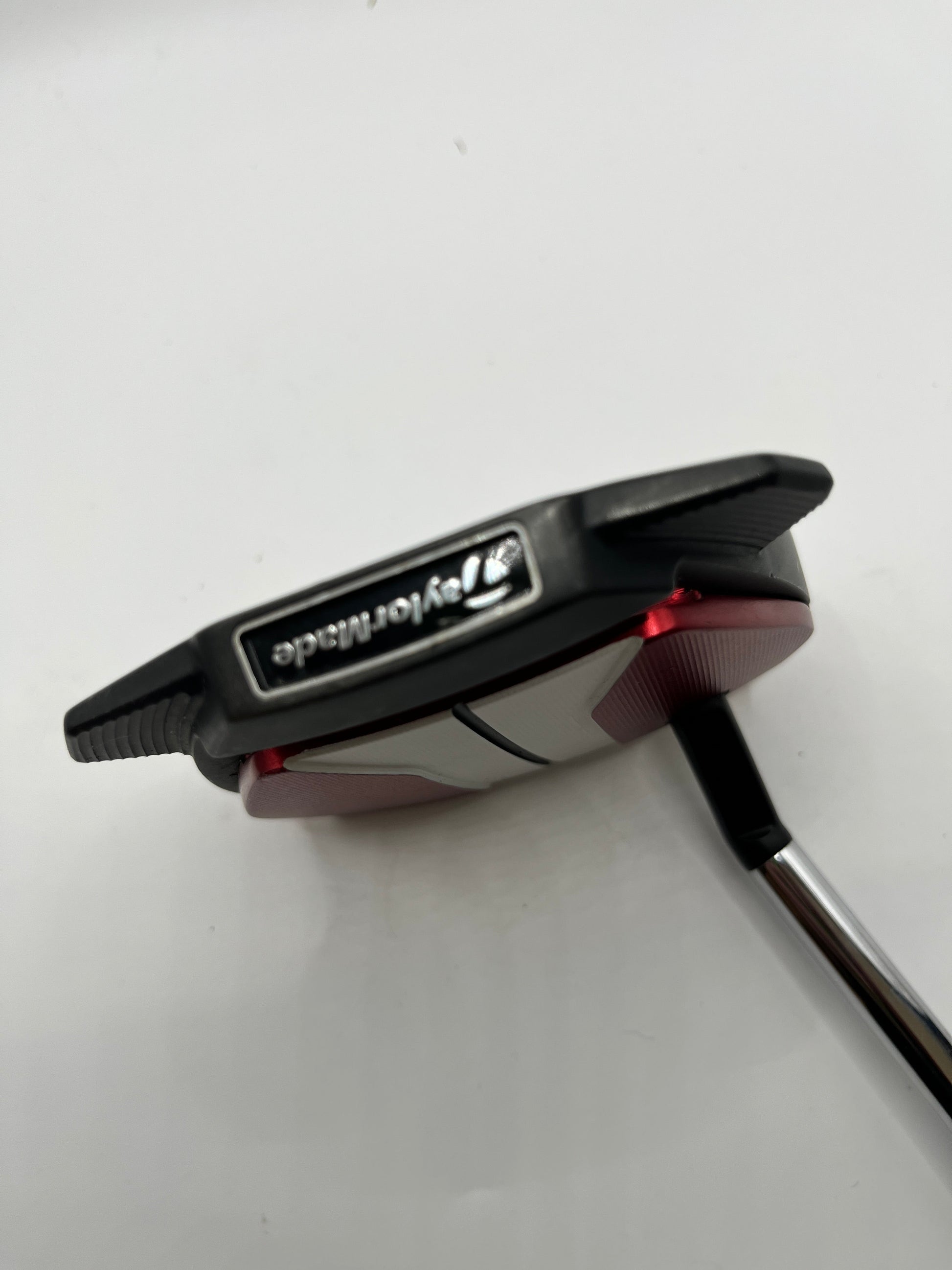 Golf putter with TaylorMade logo on a white background