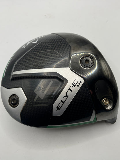 A used Callaway ELYTE driver golf club head, featuring a black and dark gray carbon fiber pattern with silver metallic accents and a small green accent line, photographed on a white background.